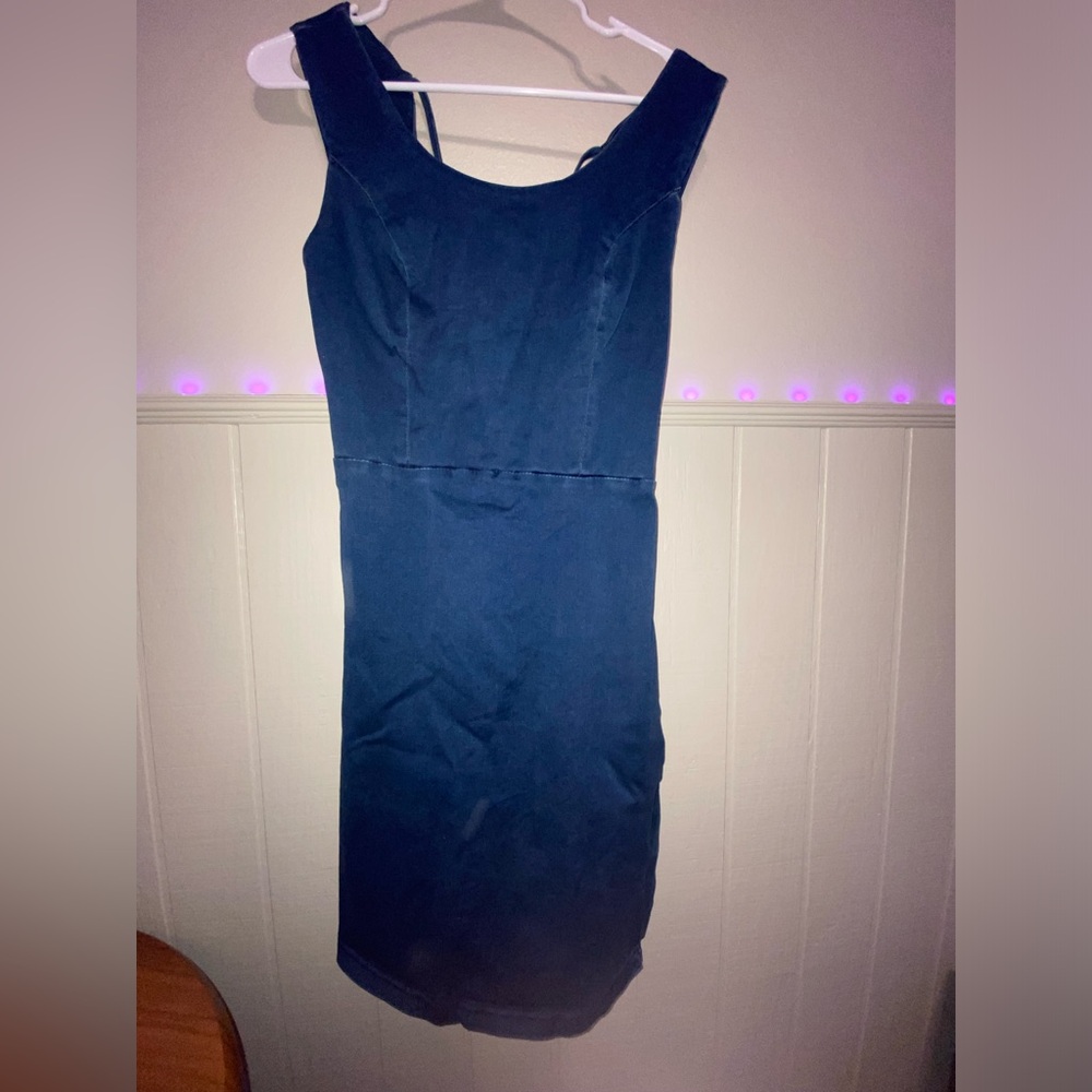 Navy blue velvet dress with lace detailing.